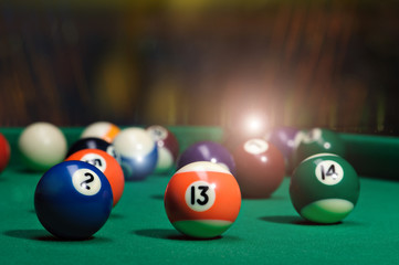 Billiard balls in a pool table.