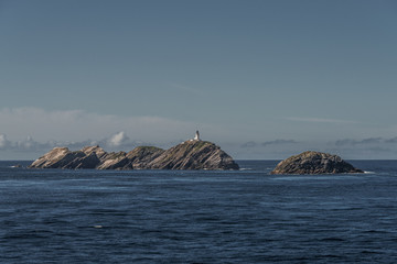 Naklejka premium Lighthouse at beautiful Faeroe islands, summer time