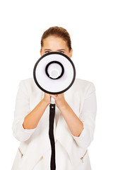 Young businesswoman holding megaphone