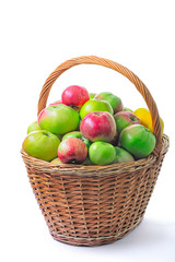 apples in a basket isolated on white background
