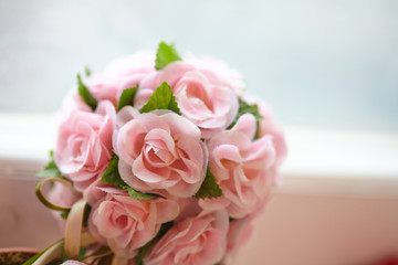 pot with flowers on the window