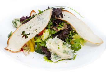 salad vegetables and goat cheese on a white background