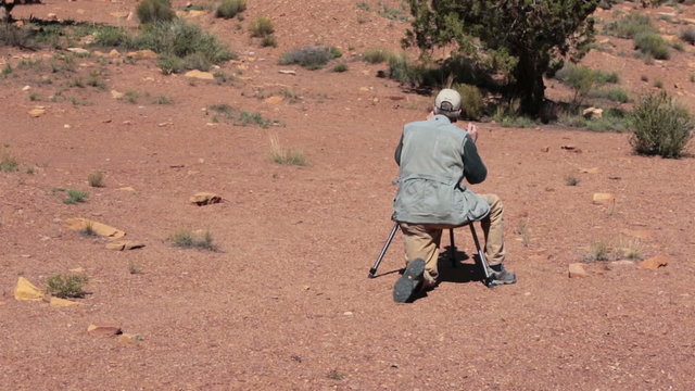 Photographer filming desert landscape HD 9940