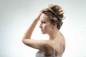Obraz premium woman washes her beautiful hair