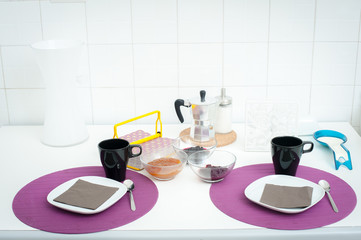 Breakfast set table in white light kitchen