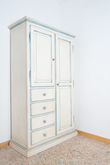 Vintage white armoire furniture in house