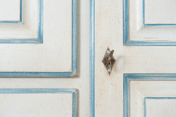 Vintage armoire detail with key and decoration