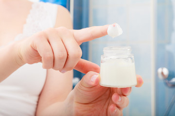 Moisturizing cream in female hands