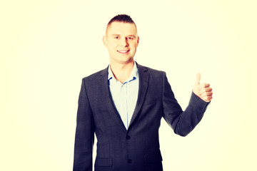 Young businessman gesturing ok sign