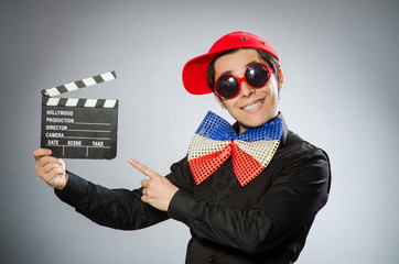 Funny man with movie clapboard