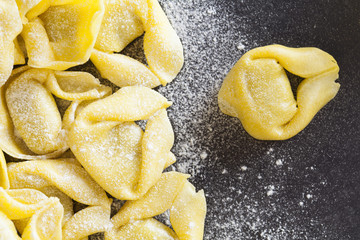 Tortellini on a blackboard background