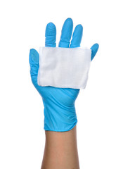 Hands of a medic wearing a blue latex gloves with gauze.