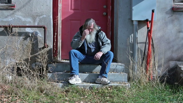 Homeless man long hair beard sad and poor HD 0141