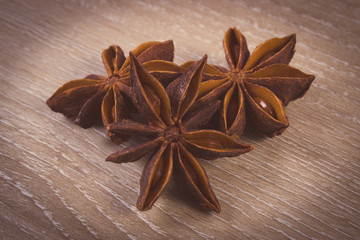 Vintage photo, Star anise spice on wooden table