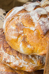 Freshly baked traditional loaves of rye bread on stall