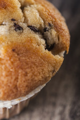 Chocolate muffin on a wooden background