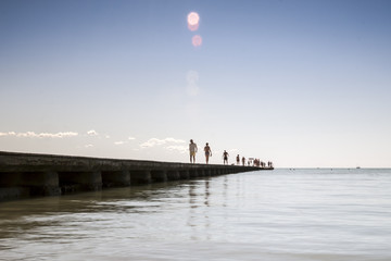 summer symbol - walking on a sea pier