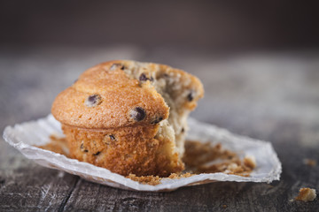 Chocolate muffin on a wooden background