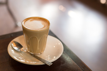 Hot art Latte Coffee in a cup on table