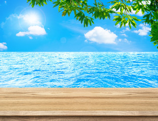 Empty wood table and tree leaf, with sea and sky background,Mock
