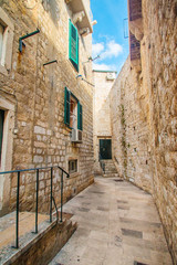 Narrow street and houses walls in the Old Town in Dubrovnik, Croatia