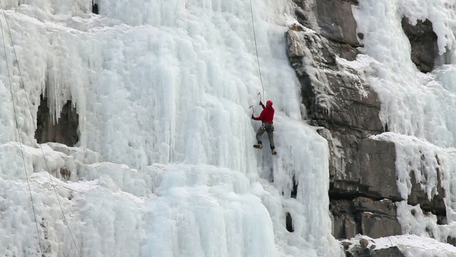 Man ice climbing mountain P HD 8924