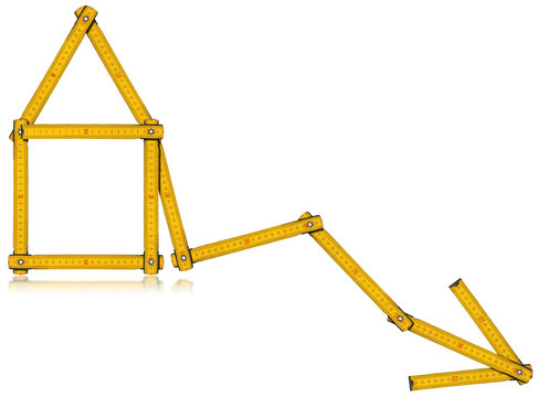 Real Estate - Decreasing Sale Graph / Wooden yellow meter in the shape of house and diagram of decrease. Isolated on white background.