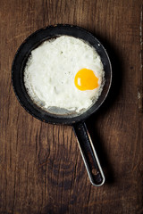 Breakfast setting with fried egg in skillet pan