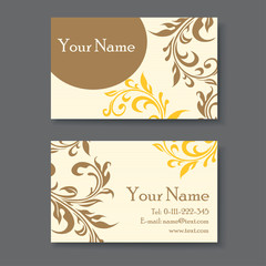 Vintage business card template with floral elements.
