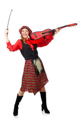 Funny woman in scottish clothing with guitar