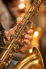 Hand of musician playing the saxophone 