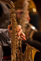 Hand of musician playing the saxophone 