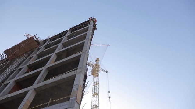 The construction of concrete buildings, a tower crane