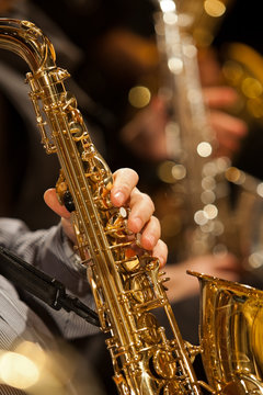 Hand of musician playing the saxophone 