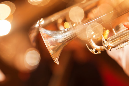 Detail of the trumpet closeup in golden tones