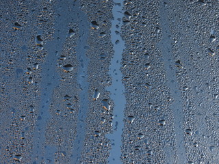  Water drops on a blue metal surface 