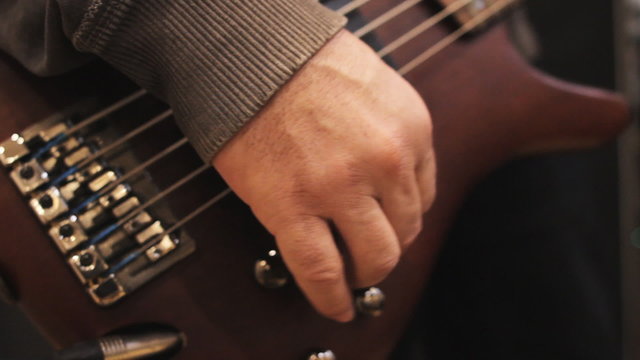 Guitarist prepares guitar. Connecting and tuning guitar