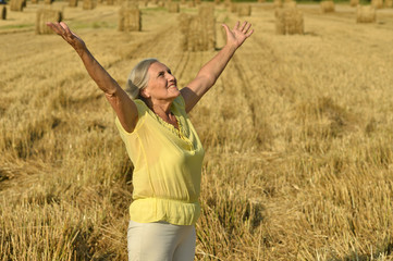 Senior woman in summer field