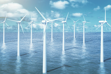 Windmills in the water with sky background