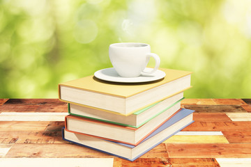 Stack of books on a vintage wooden table with cup of coffee in n