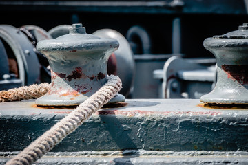 The rope accross the winch on ship