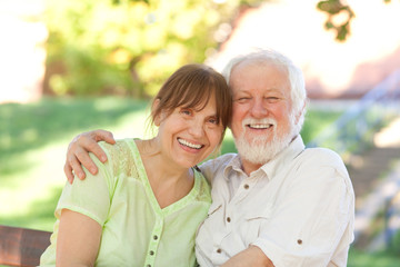 Senior couple sitting on a park bench