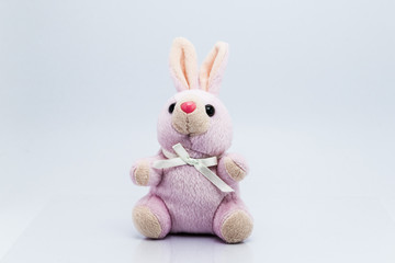 Funny knitted rabbit toy isolated on white background