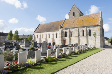 Fototapeta na wymiar Ranville church and churchyard, Normandy, France.