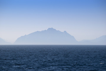 Silhouettes of Lofoten islands in the fog, Norway