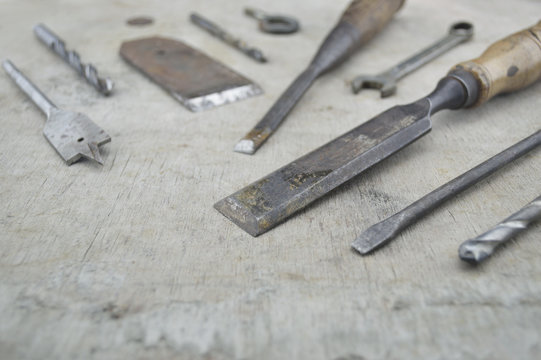 Assorted old work tools on wooden