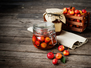 Apple jam in jar and apple fruits. Autumn still life. Selective focus.