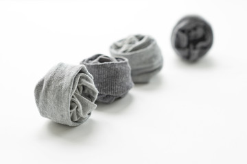 Clean laundered men's socks on a white background