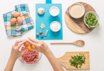 Good-looking female hands while preparing delicious traditional italian meatballs