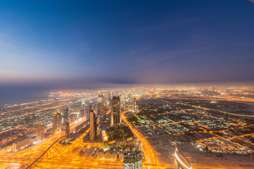 Naklejka na ściany i meble Panorama of night Dubai during sunset